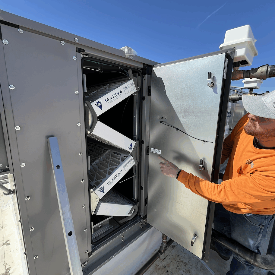 Colorado Controls technician performing maintenance on a building automation system for building owner